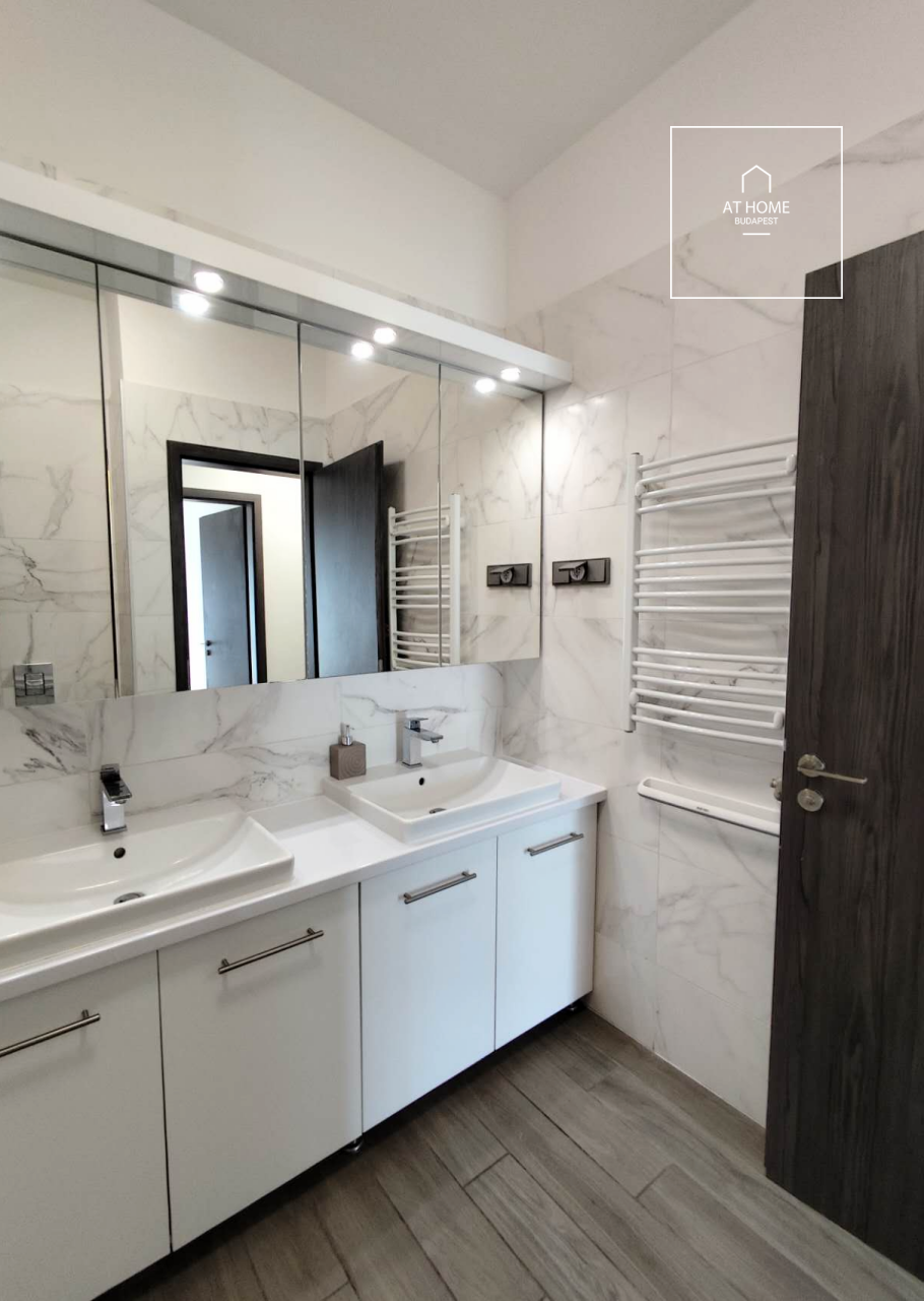 Modern ground-floor apartment with a 20 m² terrace and garden access in District XII