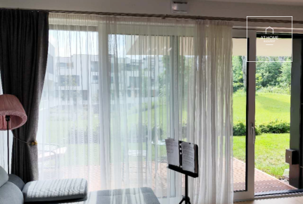 Modern ground-floor apartment with a 20 m² terrace and garden access in District XII