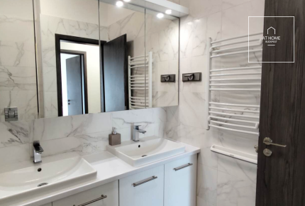 Modern ground-floor apartment with a 20 m² terrace and garden access in District XII