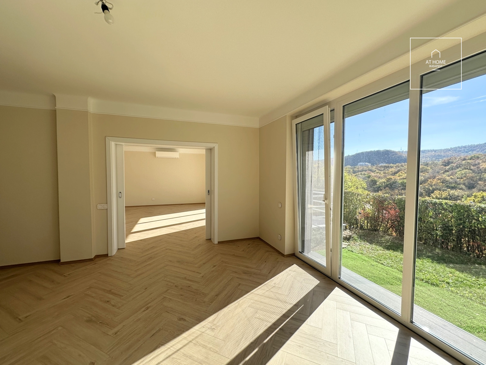 Newly renovated ground-floor apartment with garden access and a garage in District II