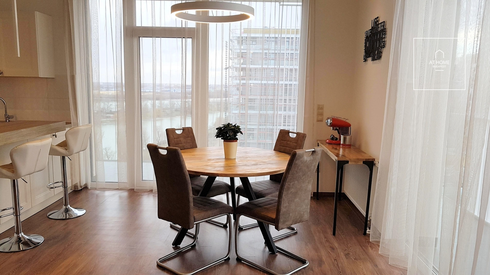 A panoramic apartment built in 2020 with a 50 sqm terrace and a garage, located near Kopaszi-gát