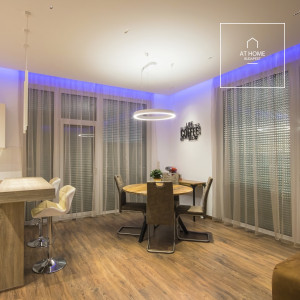 A panoramic apartment built in 2020 with a 50 sqm terrace and a garage, located near Kopaszi-gát