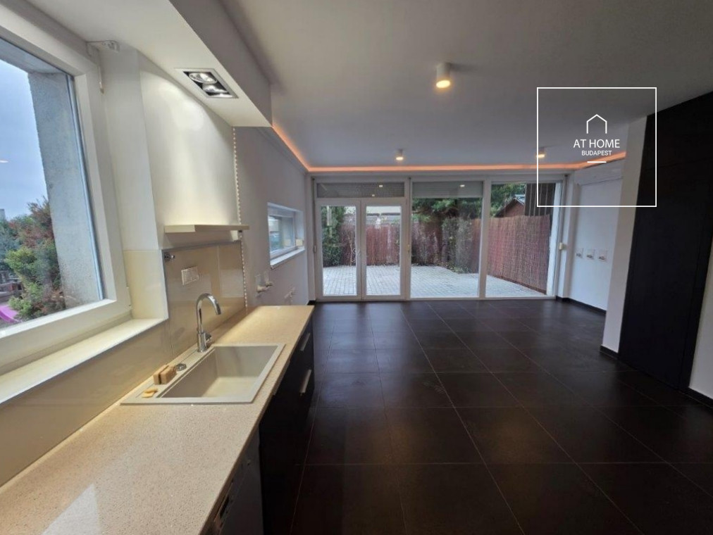 A renovated 95 sqm three-story apartment with a rooftop terrace, located in the 3rd district