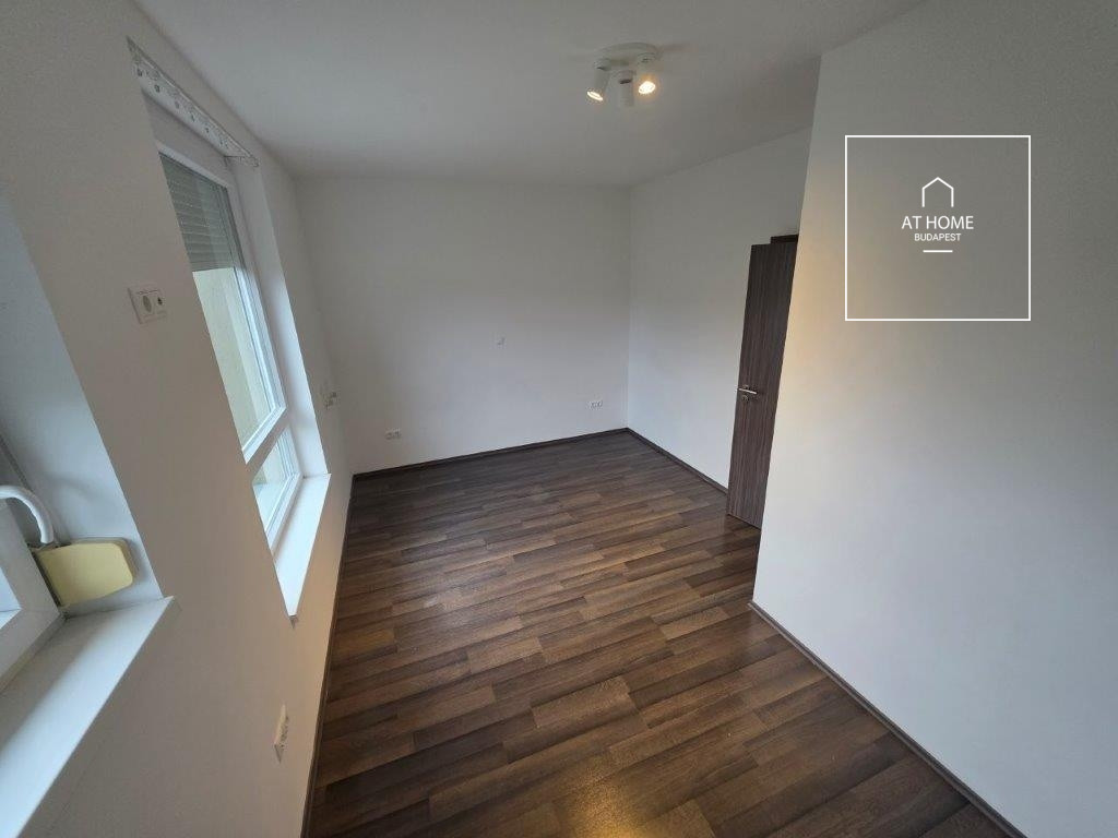 A renovated 95 sqm three-story apartment with a rooftop terrace, located in the 3rd district