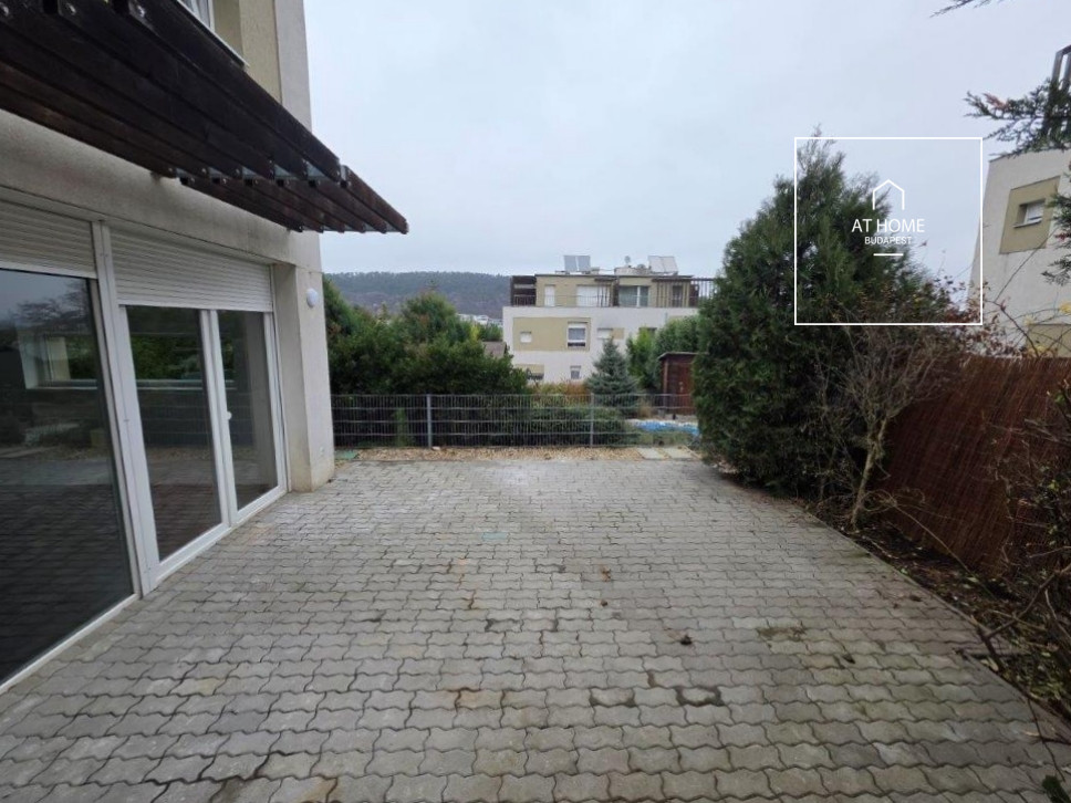 A renovated 95 sqm three-story apartment with a rooftop terrace, located in the 3rd district