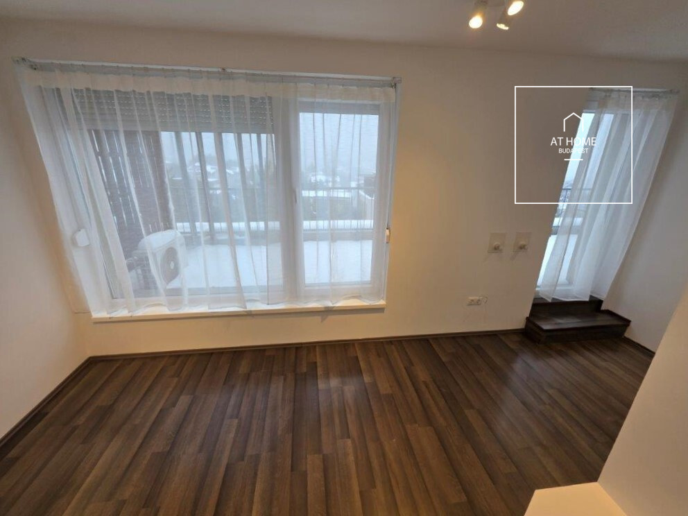 A renovated 97 sqm three-story apartment with a rooftop terrace, located in the 3rd district