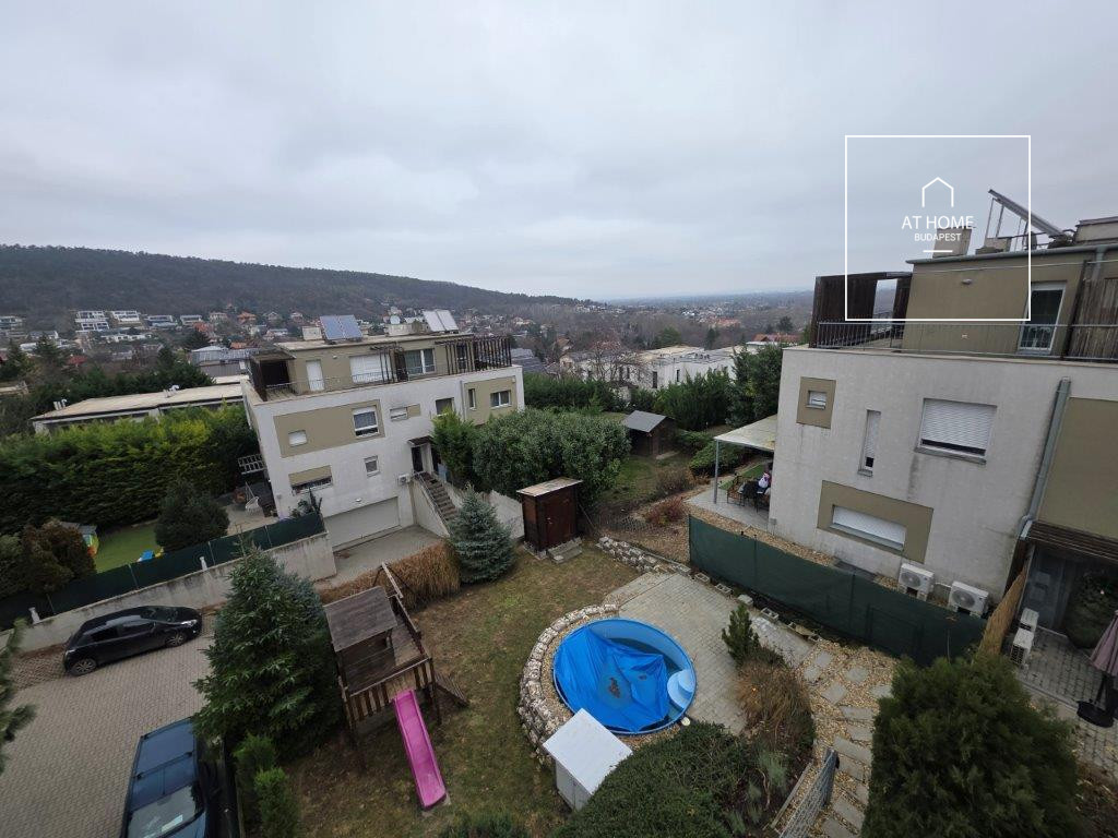 A renovated 97 sqm three-story apartment with a rooftop terrace, located in the 3rd district