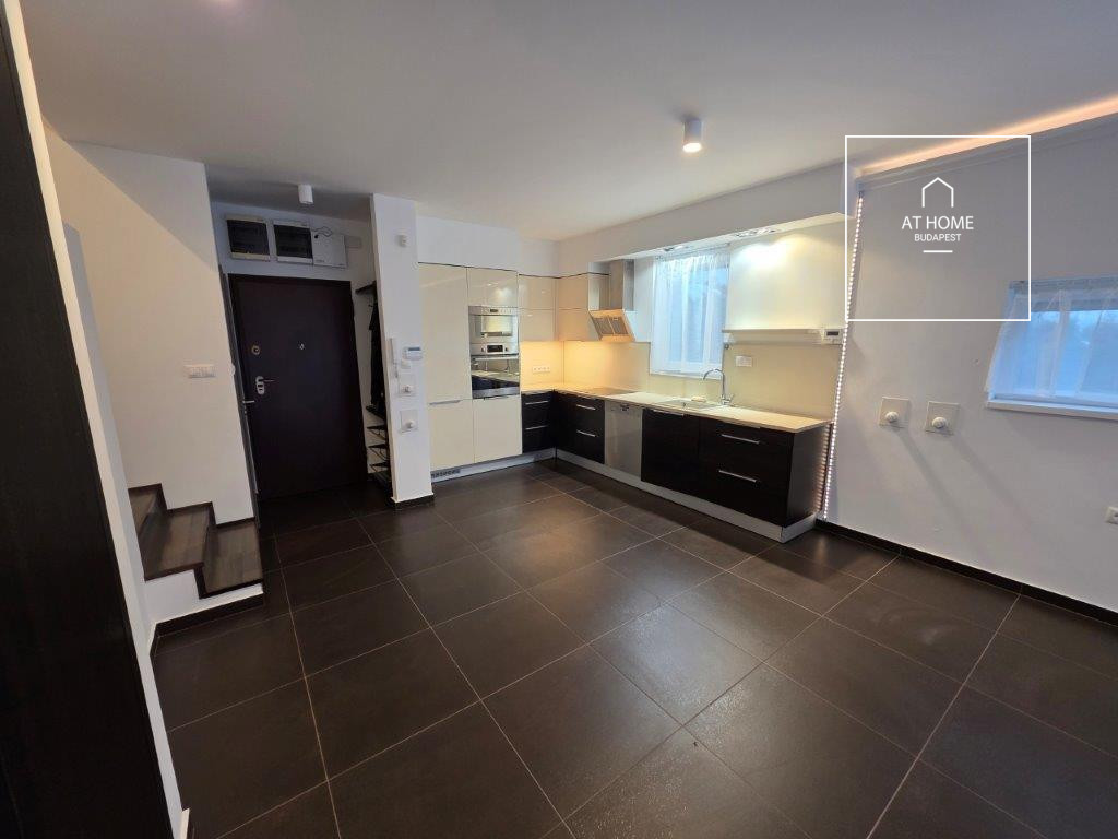 A renovated 97 sqm three-story apartment with a rooftop terrace, located in the 3rd district