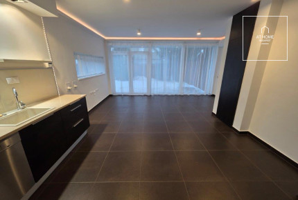 A renovated 95 sqm three-story apartment with a rooftop terrace, located in the 3rd district