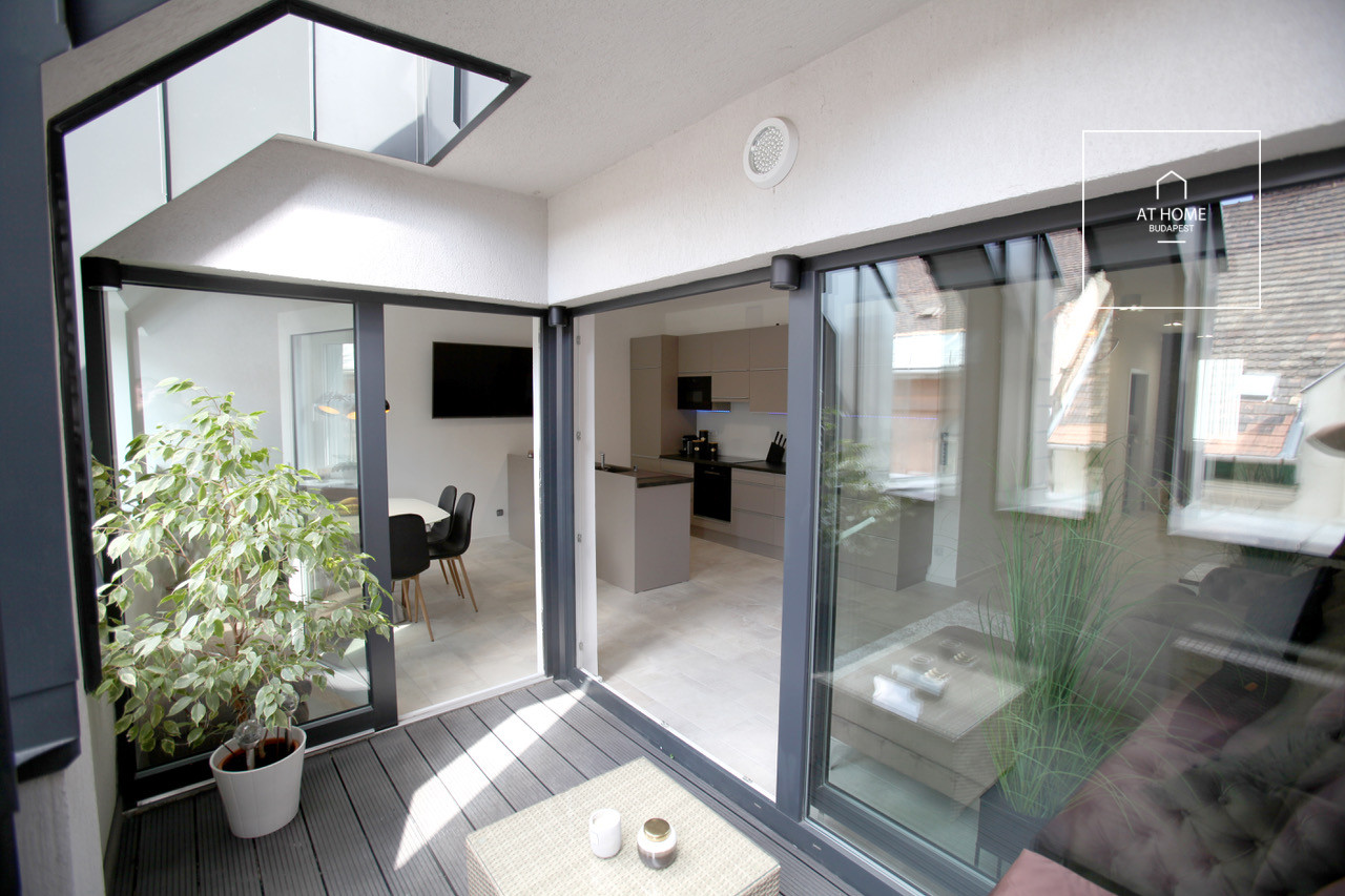 A luxury duplex penthouse apartment is available for rent in the 6th district of Budapest, Terézváros.