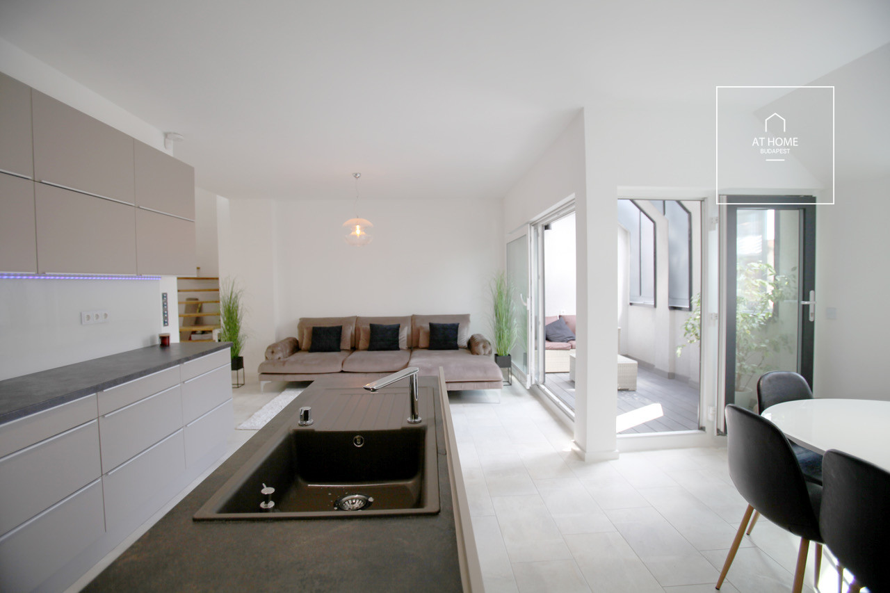 A luxury duplex penthouse apartment is available for rent in the 6th district of Budapest, Terézváros.