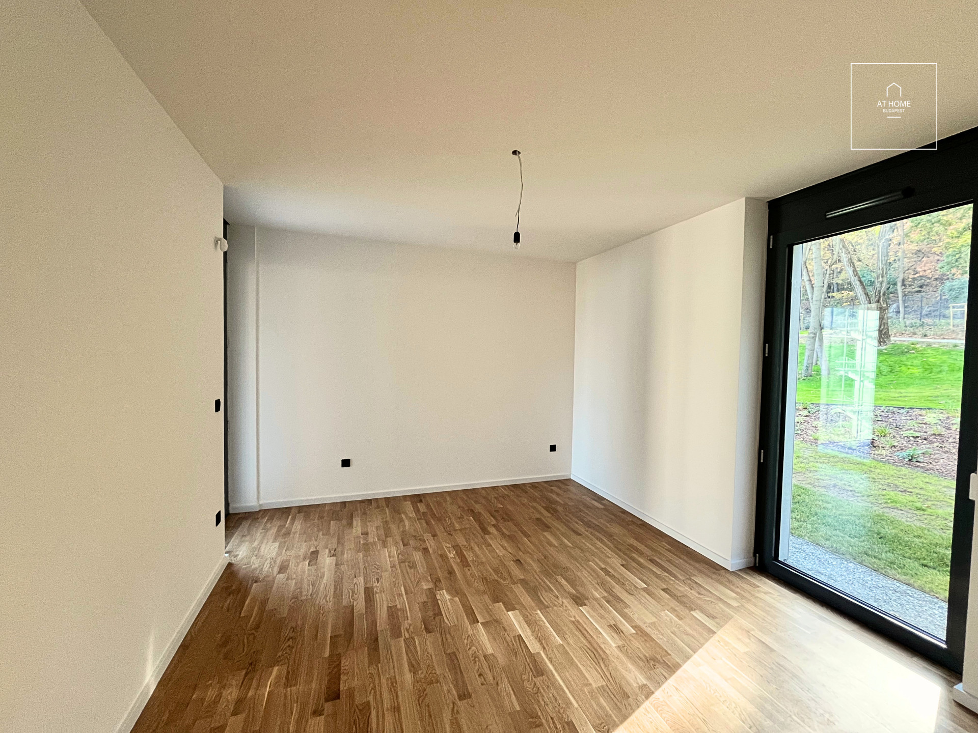 Newly built first-floor apartment with a balcony and garden access for rent in District XII